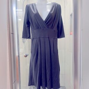Soft polyester spandex grey dress, excellent condition. Sleeves go past elbows
